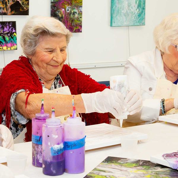 resident participating in crafting activity